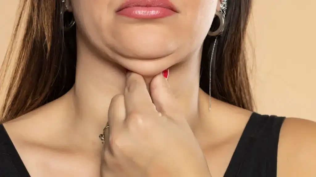 An image of a woman with double chin, sad, worried : Non Surgical Double Chin Removal Treatment in Wrexham, UK